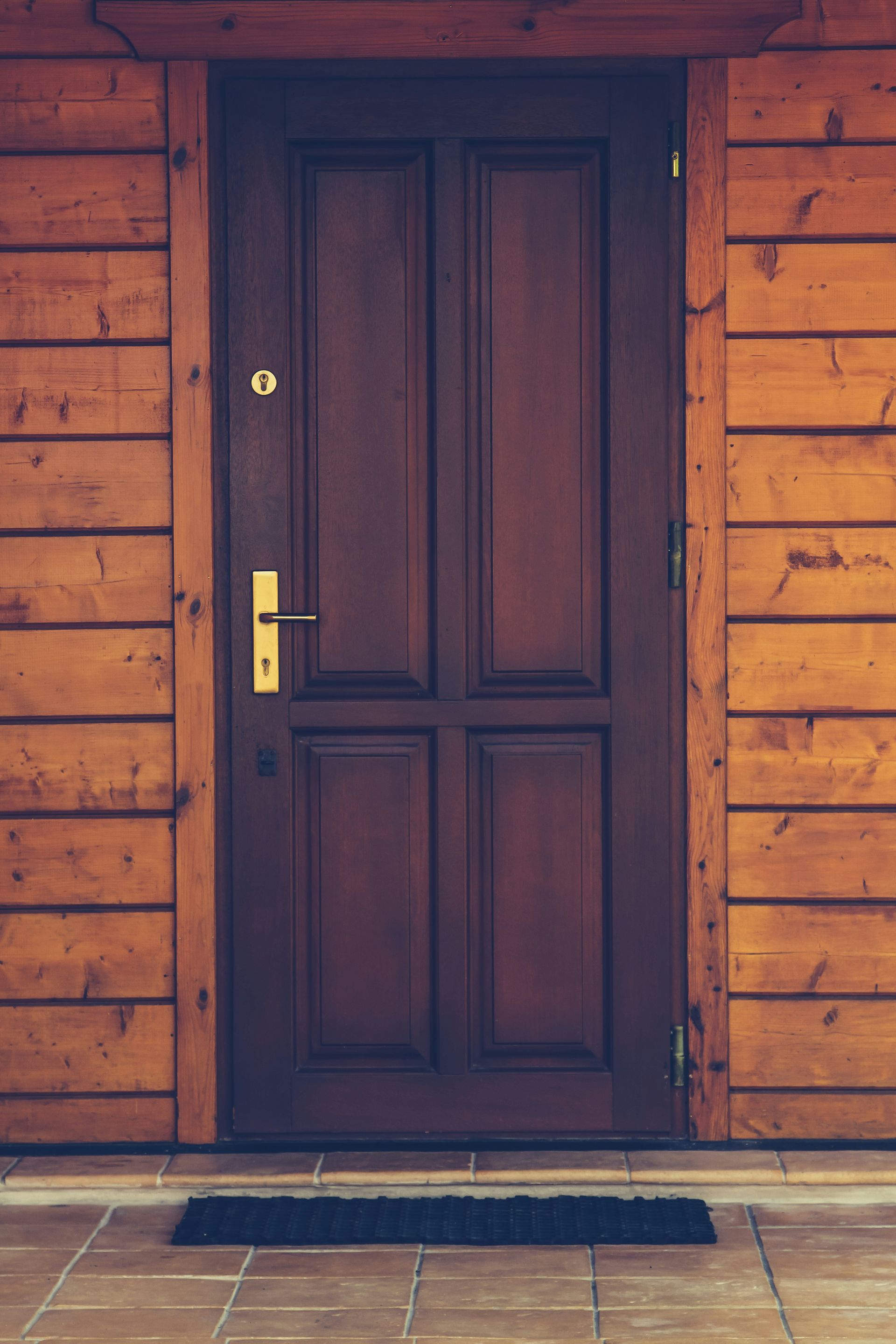 black wooden 4-panel door closed